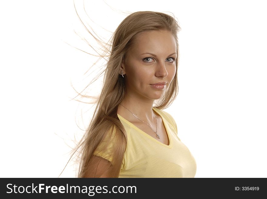 A girl in yellow short with blonde tousled hair. A girl in yellow short with blonde tousled hair