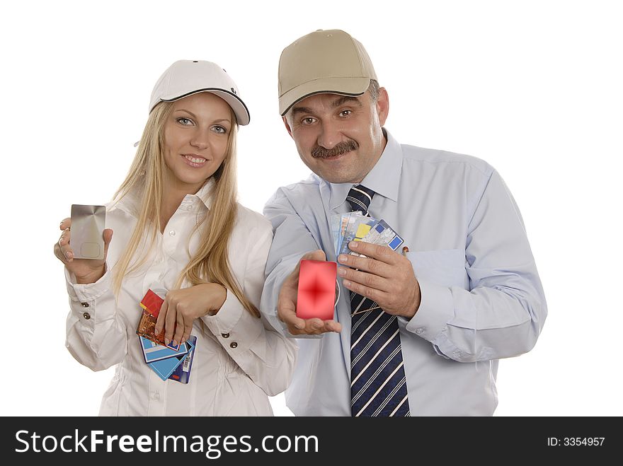 Smiling man and woman in caps with credit cards. Smiling man and woman in caps with credit cards
