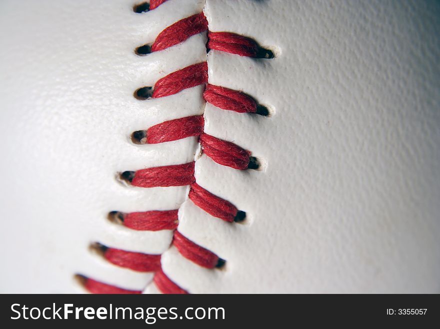 A white Baseball Macro with red stitching