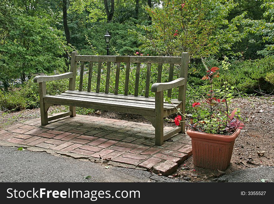 An old bench and flowers in a public park