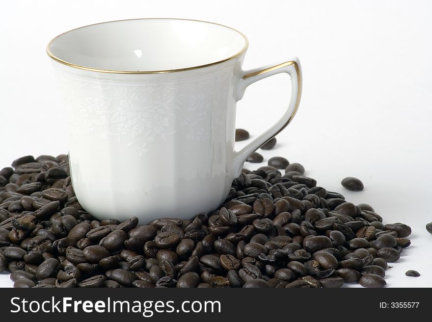 Coffee Cup Sitting In Beans