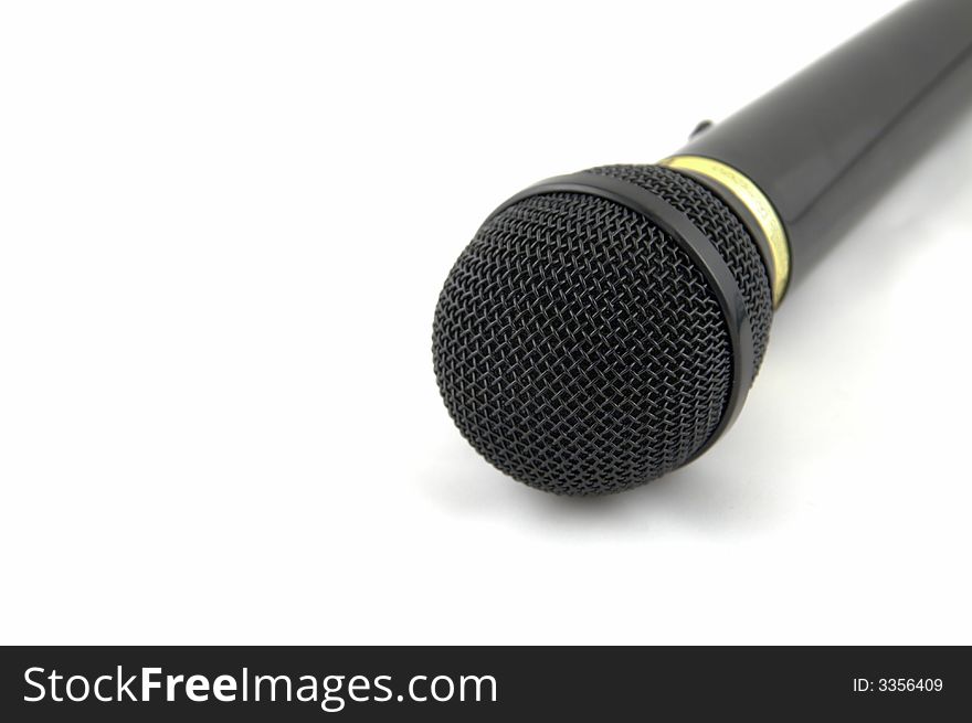 Black microphone on a white background.