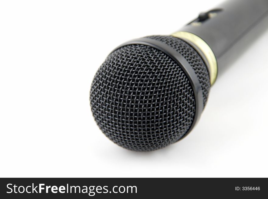 Black microphone on a white background.