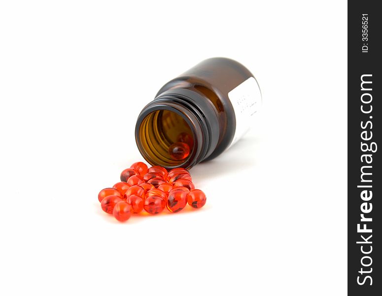 A jar with tablets of red color