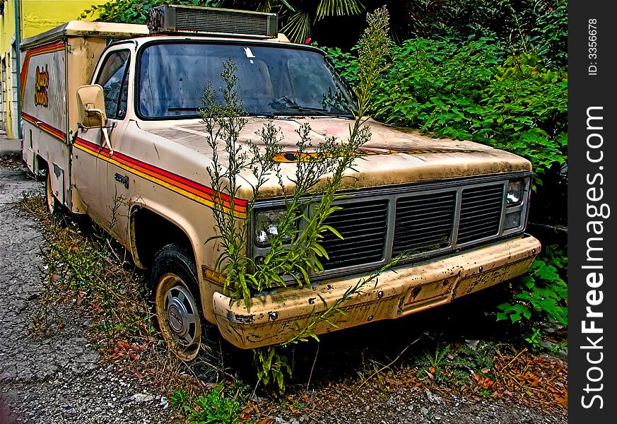 Old car damaged on evacuated street