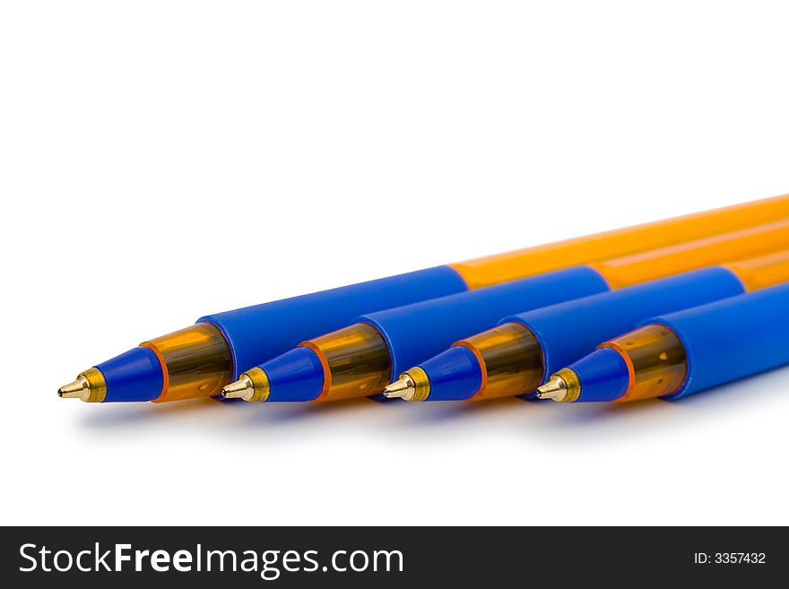 Four pens, close-up, isolated on white background