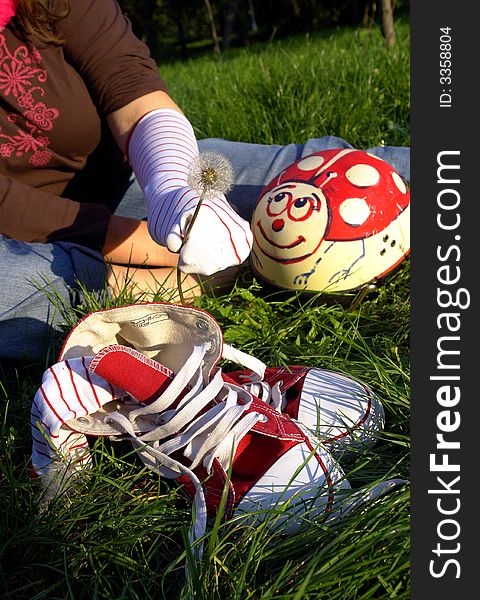 Shoes and helmet on grass