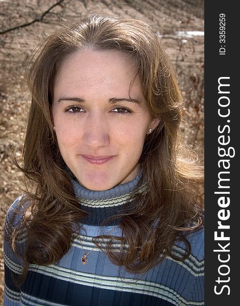 A head shot of a girl with beautiful brown eyes