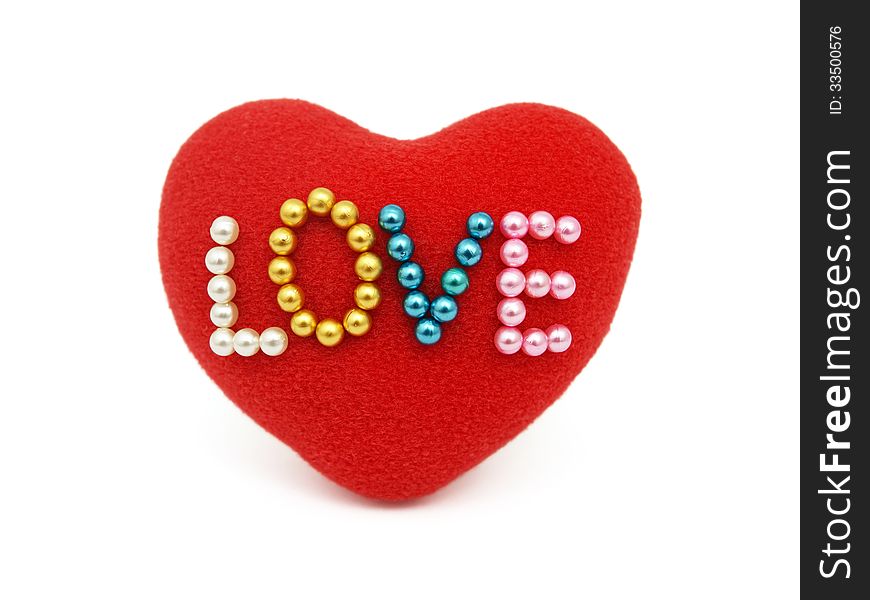 Red heart with pinned love on white background