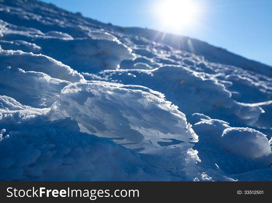 Sun and snow mountains landscape