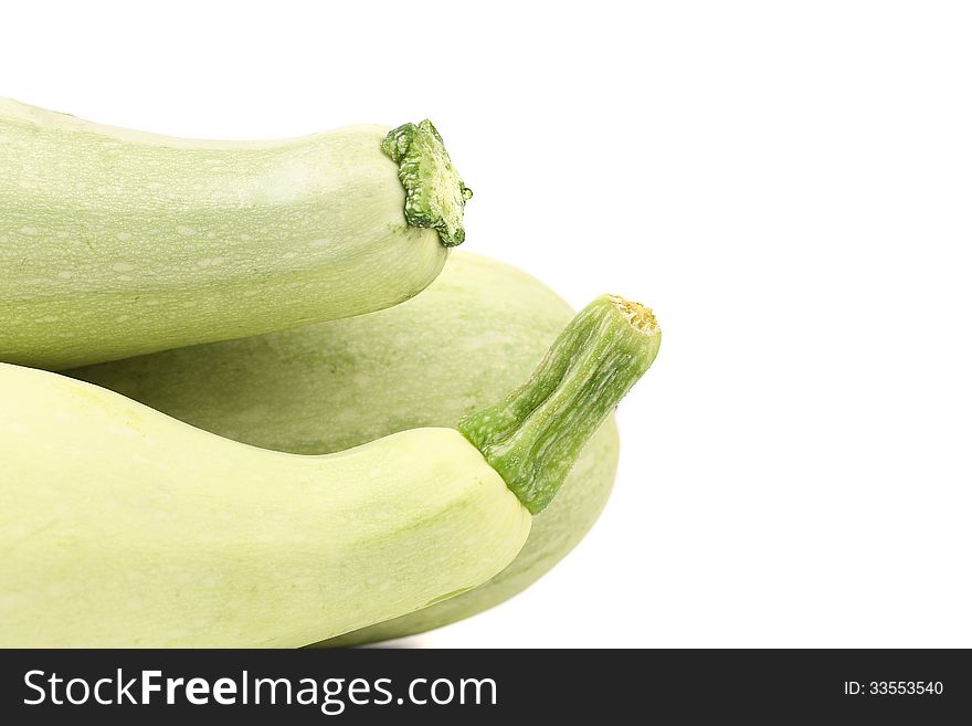 Tails of fresh vegetable marrow. Isolated on a white background.