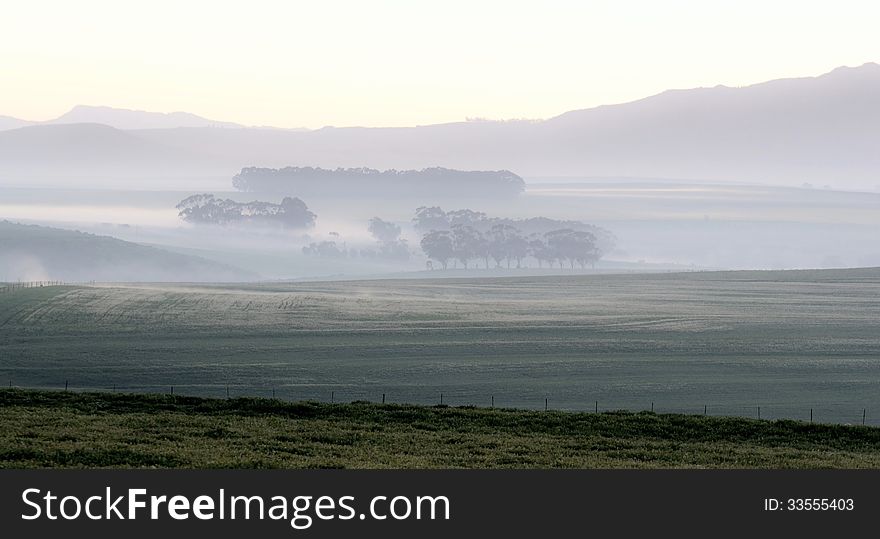 Landscape with mountains and fields at dawn. Landscape with mountains and fields at dawn