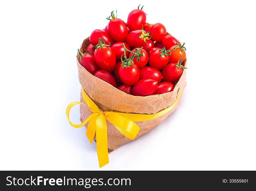 Tomatoes in paper bag isolated on white