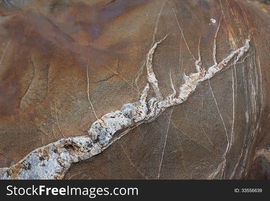 Surface of natural   rust-streaked stone