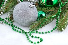 Christmas Balls And Garland On A Spruce Branch Royalty Free Stock Photo
