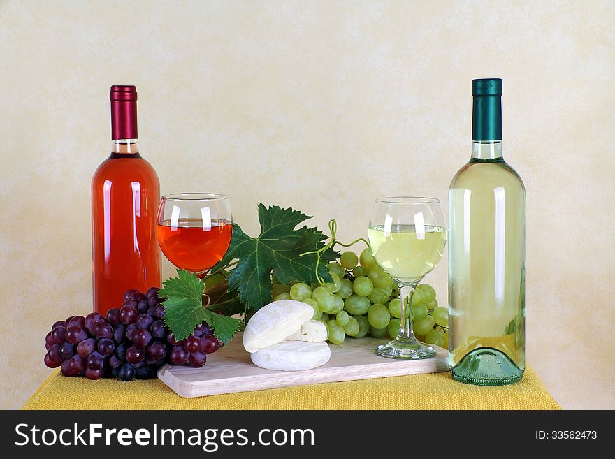 Wine rosé and white wine with grapes and cheese typical. Wine rosé and white wine with grapes and cheese typical
