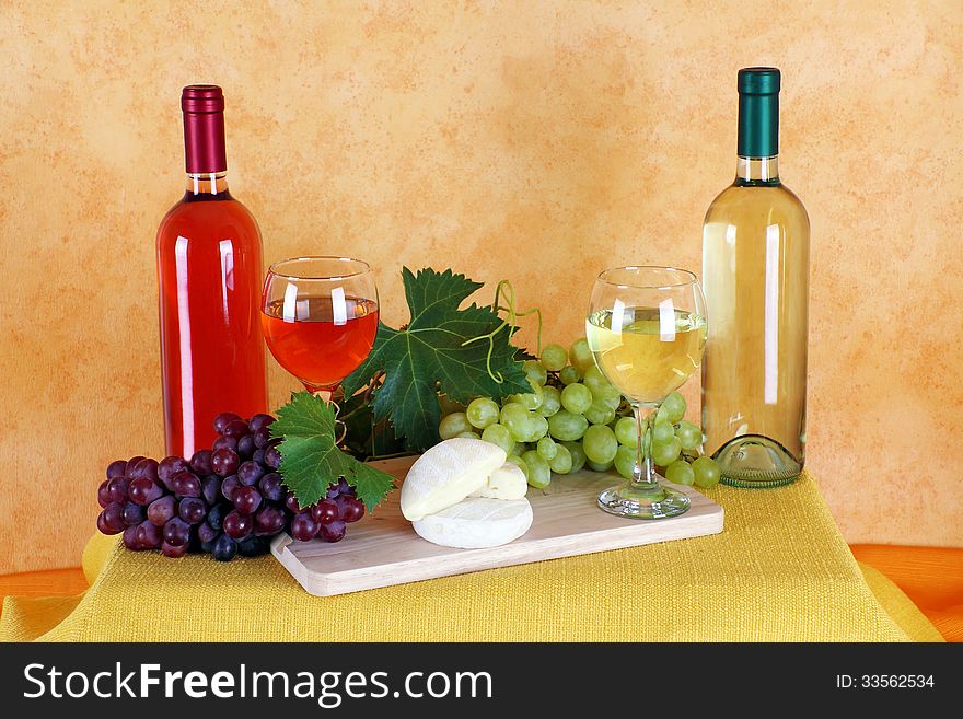 Wine rosé and white wine with grapes and cheese typical. Wine rosé and white wine with grapes and cheese typical