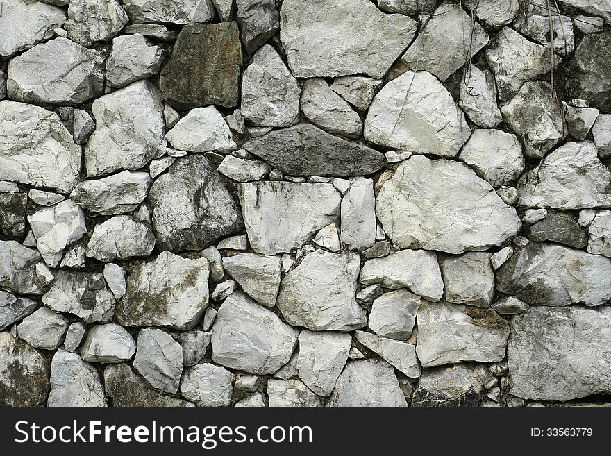 Pattern of old stone wall texture background