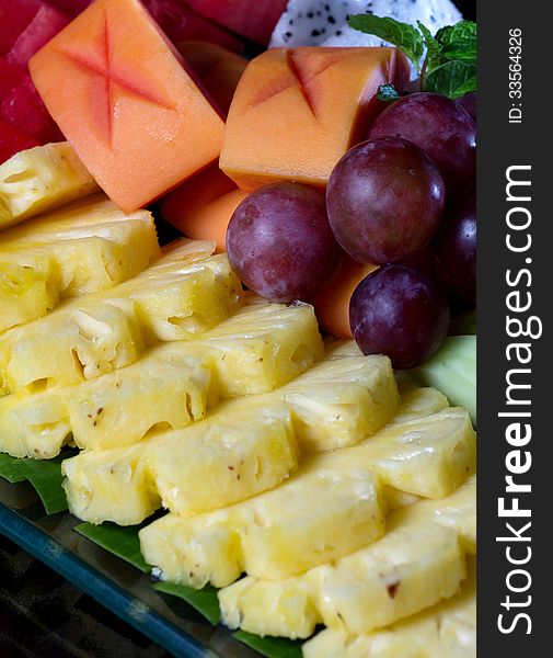 Fresh asian fruit peeled pineapple papaya grape. Fresh asian fruit peeled pineapple papaya grape