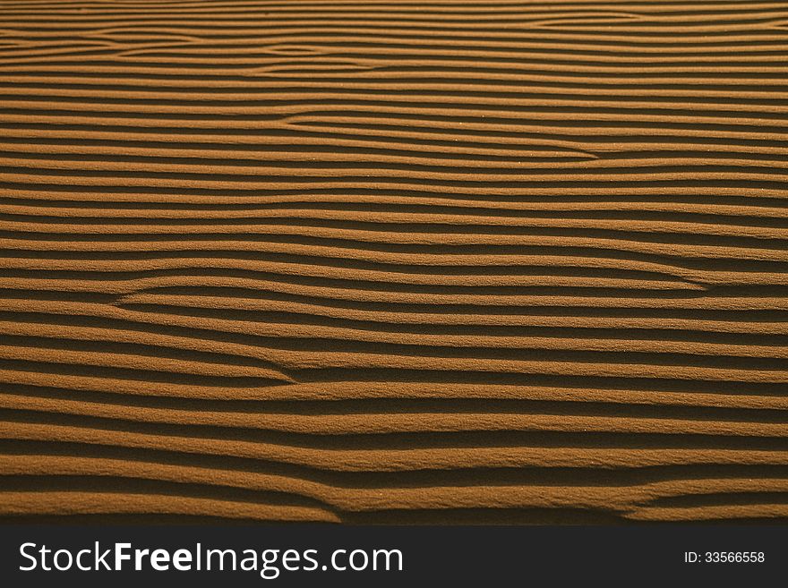 Abstract Background: Desert Ripples in the Sand