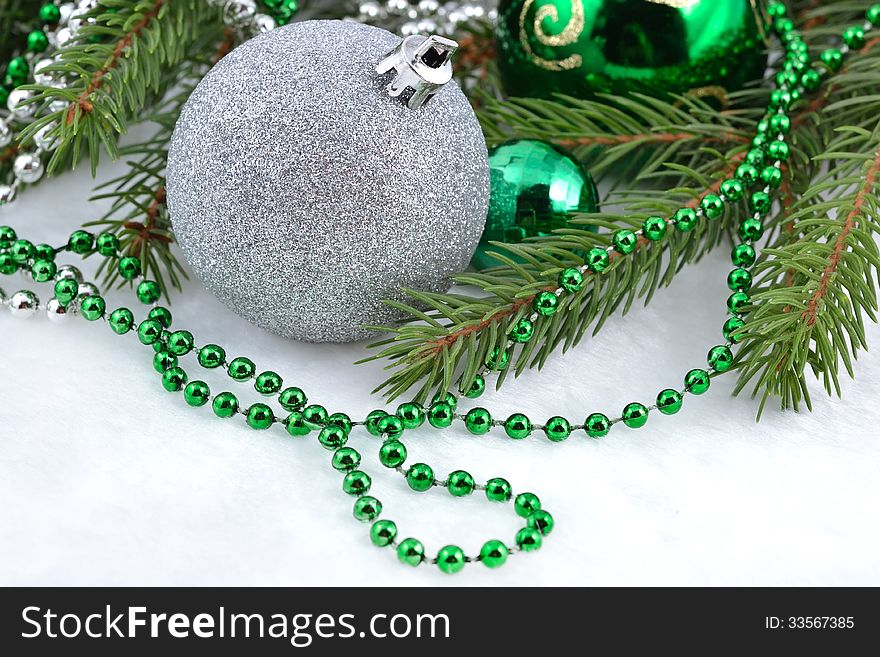 Christmas Balls And Garland On A Spruce Branch