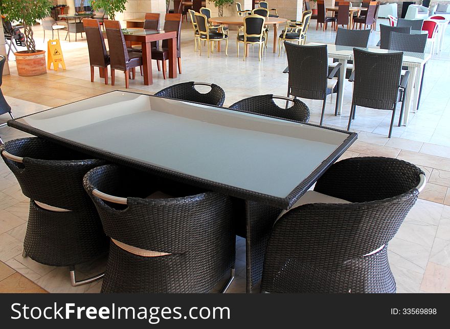 Empty restaurant with set tables and modern chairs.Elegant furniture for resort. Empty restaurant with set tables and modern chairs.Elegant furniture for resort.