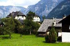 Traditional Wooden Houses In Hallstatton The Background Of The Alps Royalty Free Stock Photo Traditional Wooden Houses In Hallstatton The Background Of The Alps Royalty Free Stock Photo