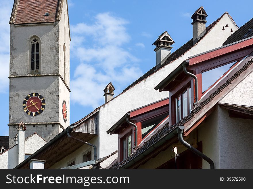 Church tower, chimneys and roofs
