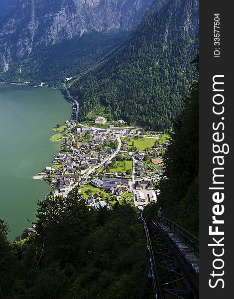 View from the top of the mountain through the railroad track down to the lake Hallstatt Austria