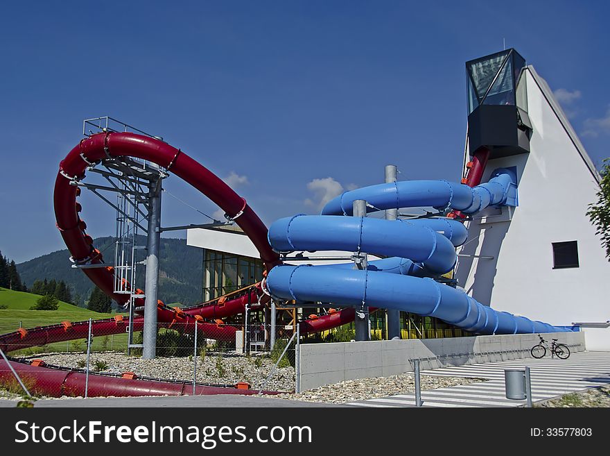 Red and blue water slide in aqua park
