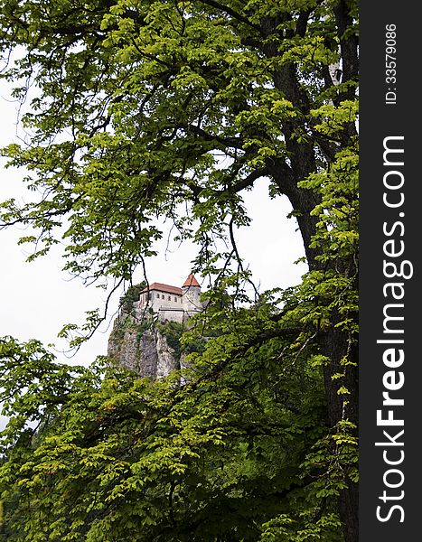 Bled Castle On The Cliff Between The Branches Of A Tree