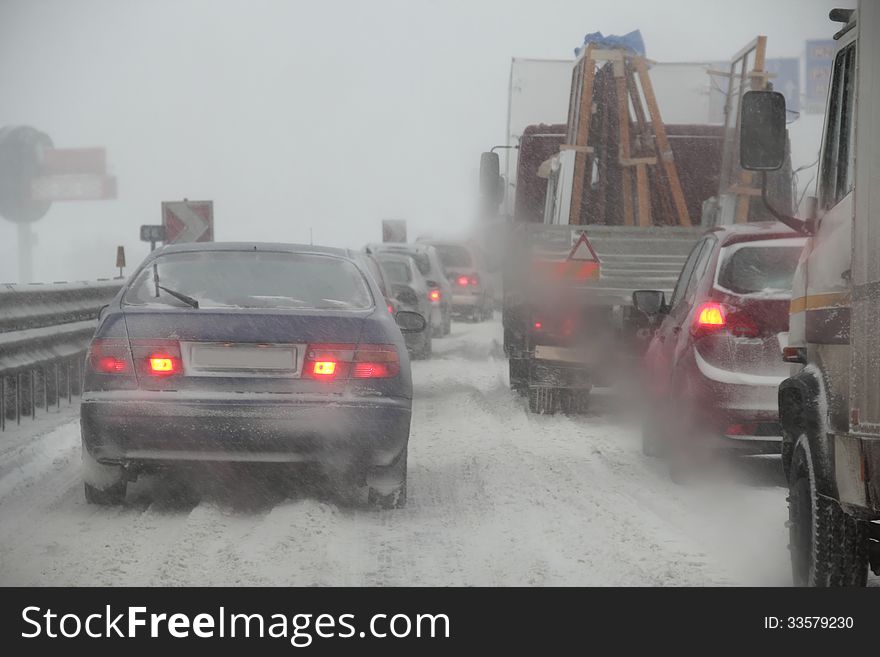 Traffic jam, cars in bad weather.