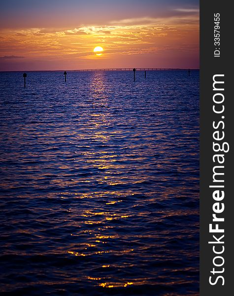 Beautiful golden sunset over the horizon in Destin, Florida