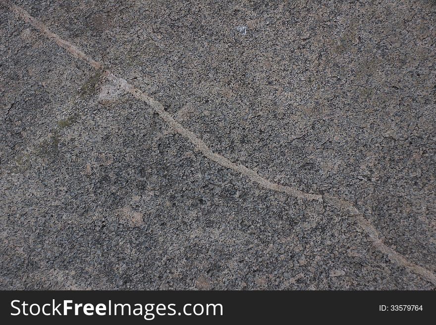 Surface of natural gray stone with transverse line as background. Surface of natural gray stone with transverse line as background