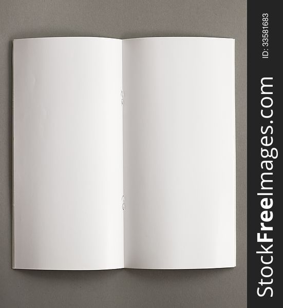 Top view of open blank notepad isolated on grey background