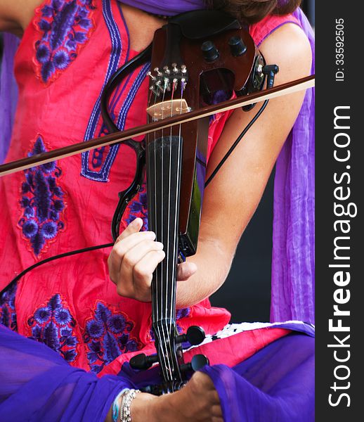 Hands Of A Musician Playing The Electric Violin