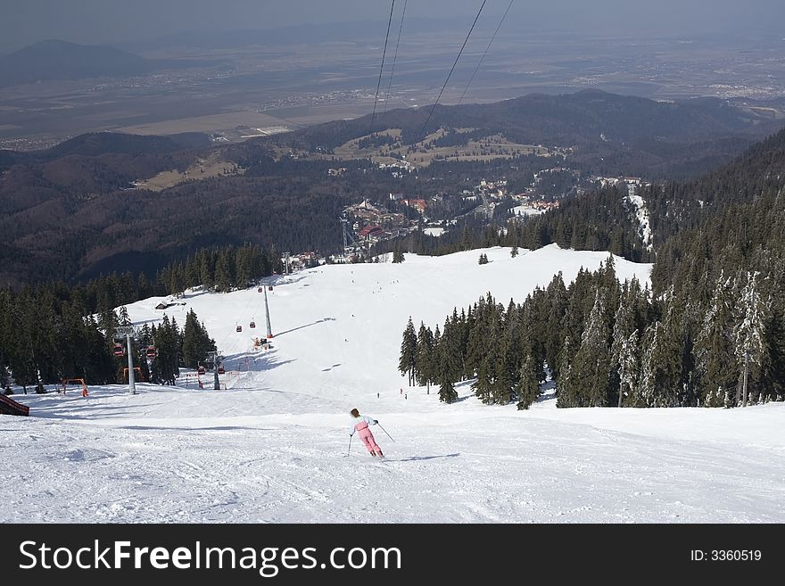 Ski resorts in a sunny day with firs cover with snow
