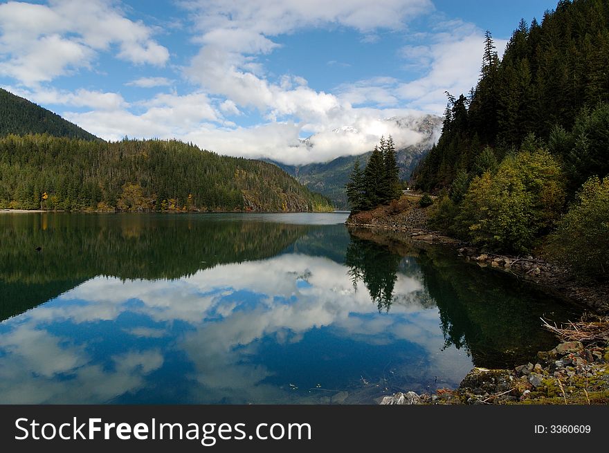 Reflection of Cascade Mountain Peak in the lake. Reflection of Cascade Mountain Peak in the lake