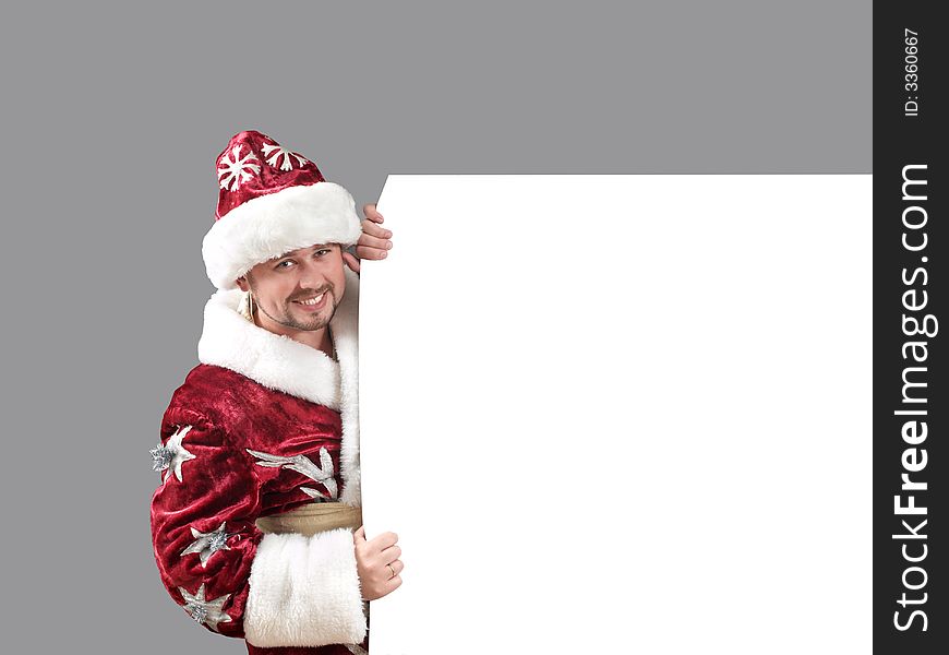 Santa Claus carrying a shield for advertisement. Santa Claus carrying a shield for advertisement