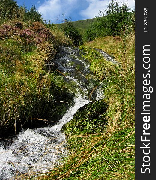 Freshwater stream running down a mountainside. Freshwater stream running down a mountainside
