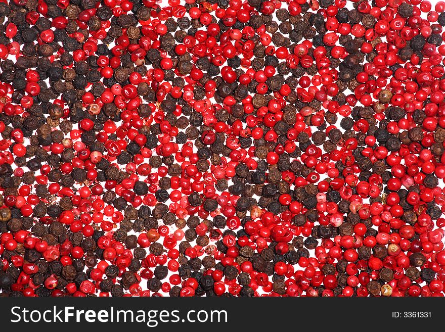 Close-up of dried black and red peppercorns