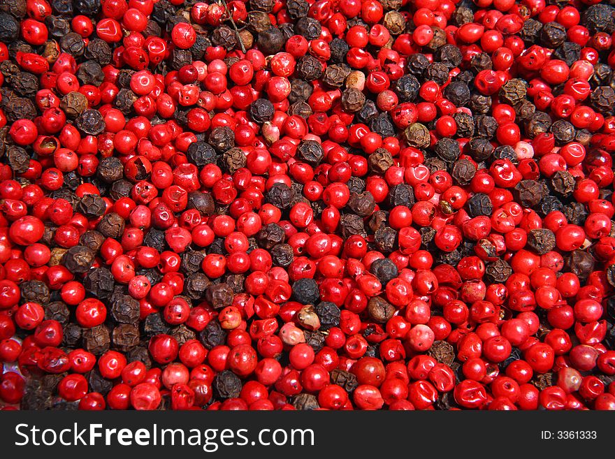 Close-up of dried black and red peppercorns