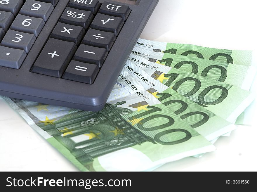 Cost control, european 100 euro bills and calculator