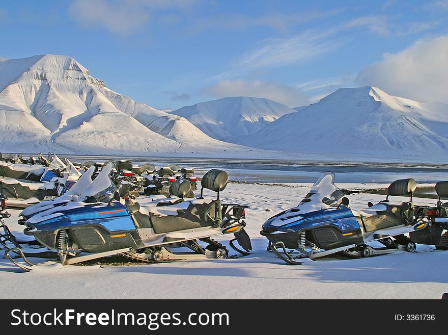 Snow mobiles for rent on a parking lot. Snow mobiles for rent on a parking lot