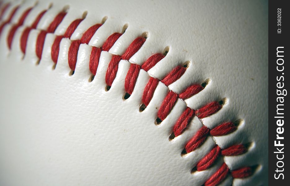 A white Baseball Macro with red stitching