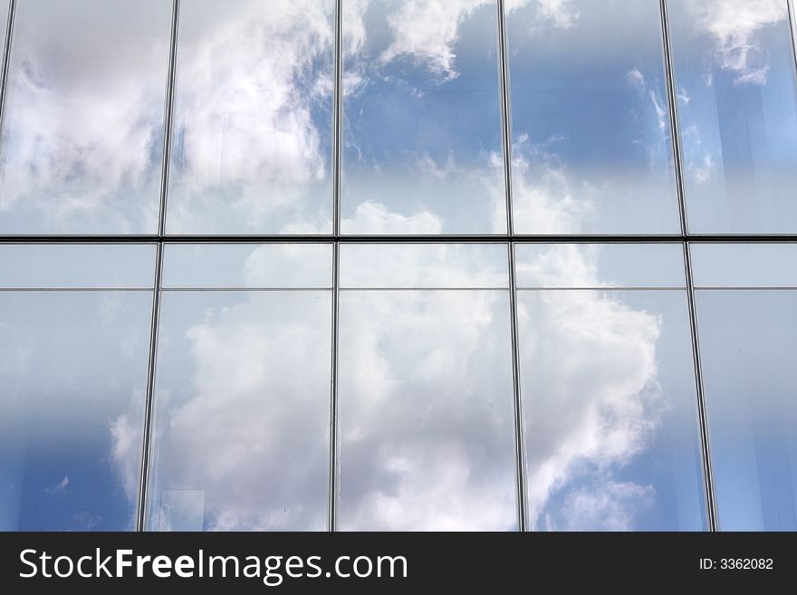 Cloud reflections on glass office building. Cloud reflections on glass office building