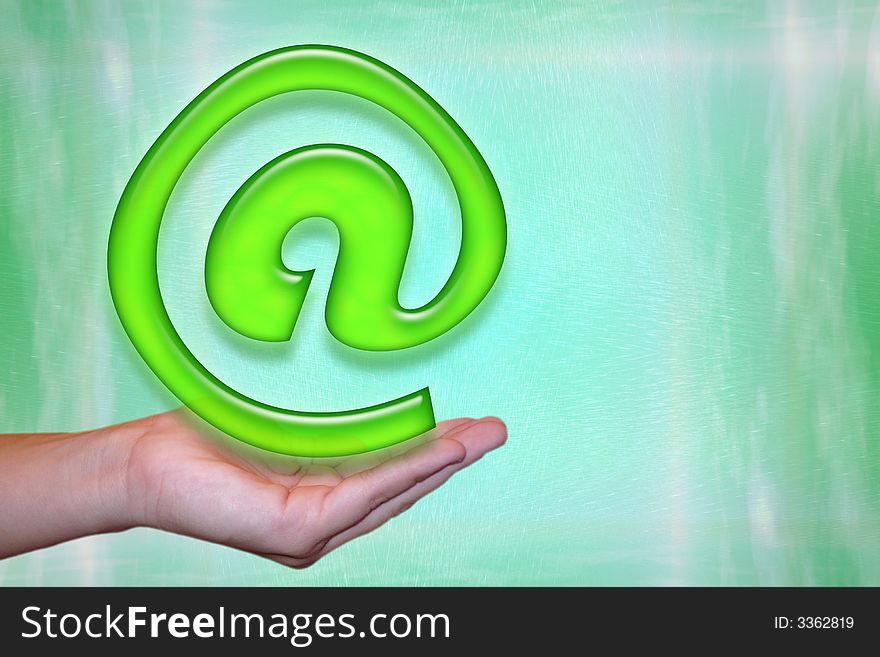 E-mail concept on a palm in front of a green background. E-mail concept on a palm in front of a green background