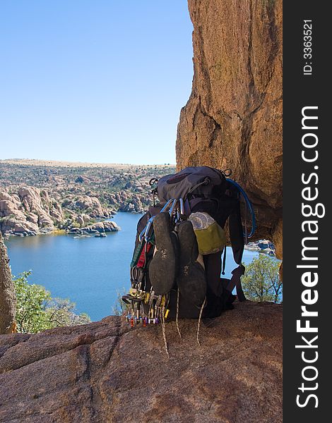 A backpack loaded down with climbing gear sits on the edge of a wonderful view of Watson Lake, Prescott, AZ. A backpack loaded down with climbing gear sits on the edge of a wonderful view of Watson Lake, Prescott, AZ.