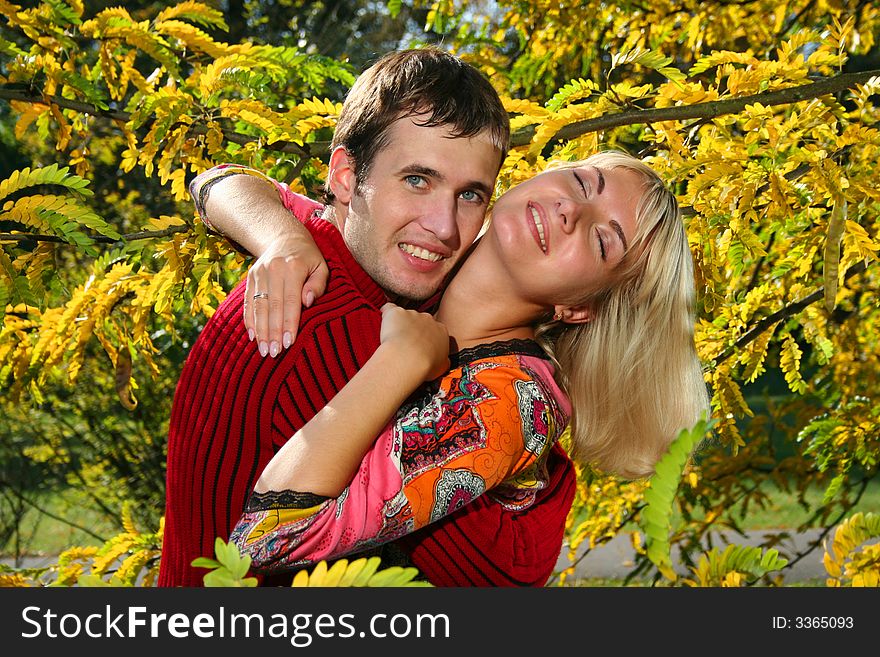 Young couple hugging in autumn park. Young couple hugging in autumn park