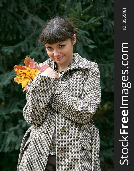 Beautiful woman walking in the autumn park. Beautiful woman walking in the autumn park